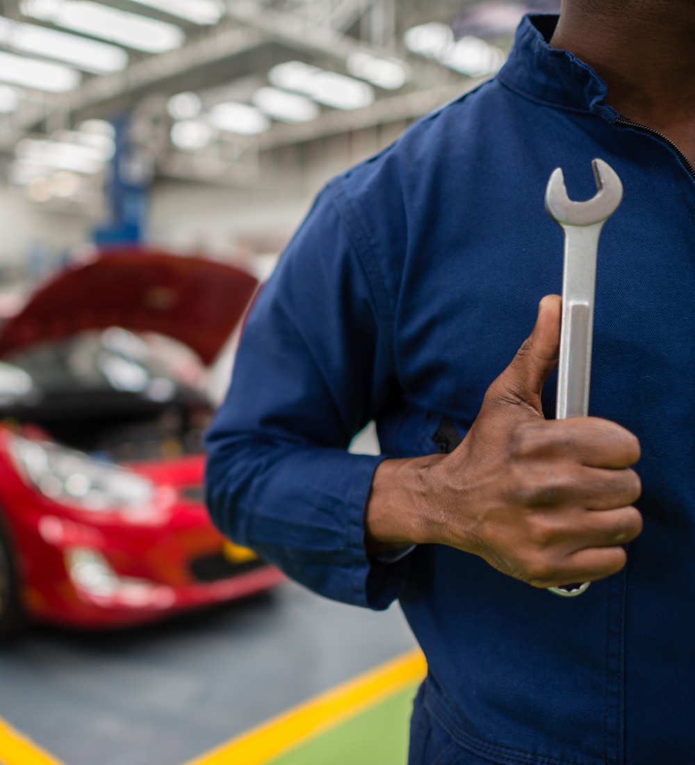 Mechanic with repair tool in hand